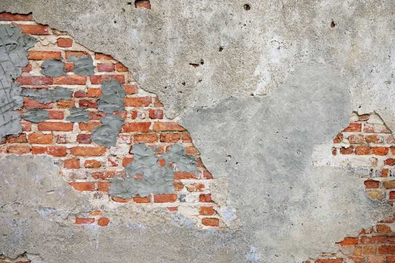 Old render patched back to sound brickwork