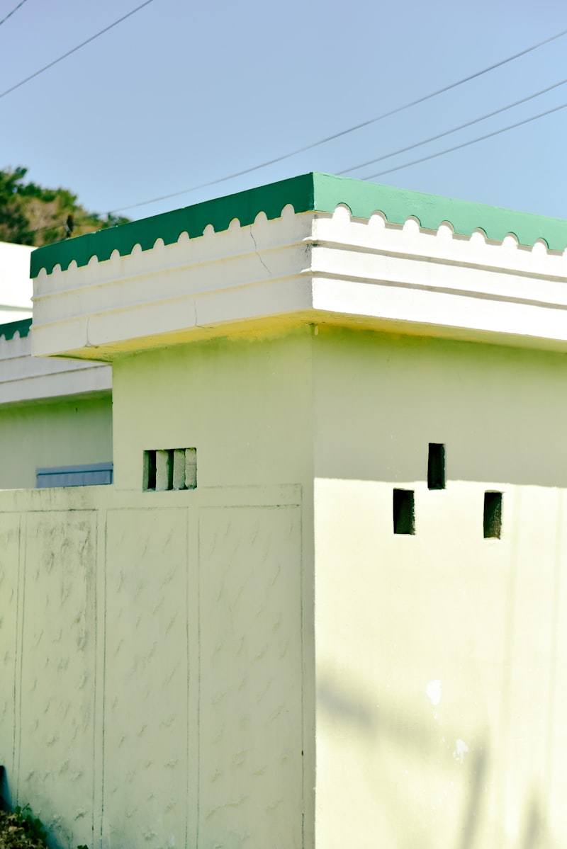 A rendered house with a green roofline